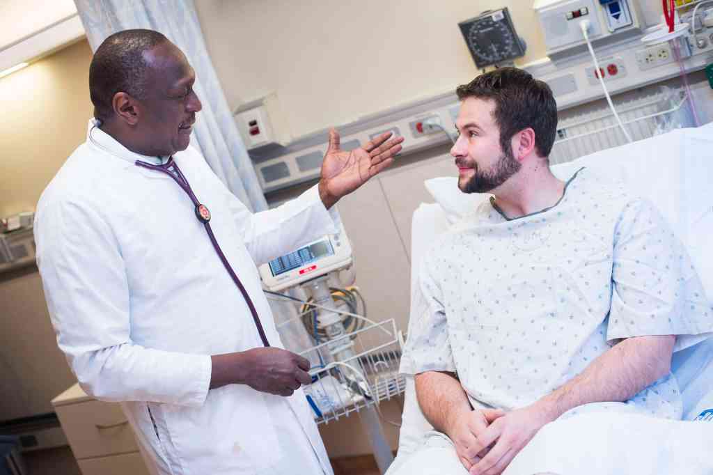 A person with factitious disorder talking to a doctor