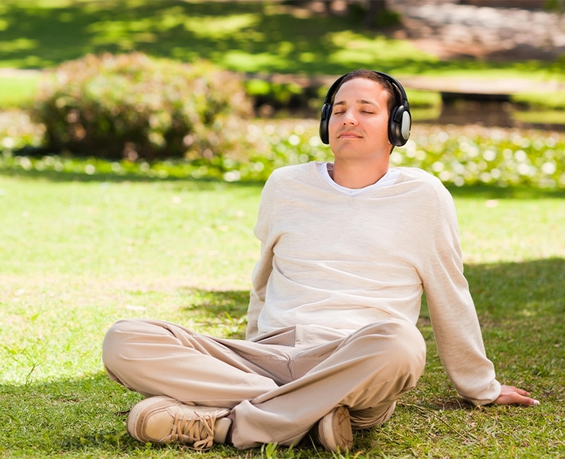 Man listening to music in the park