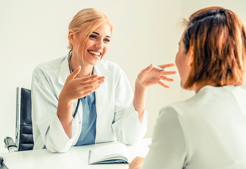 Female patient visits woman doctor or gynecologist during gynaecology check up in office at the hospital.