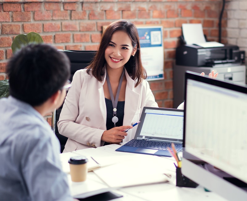 business woman explaining in group of people